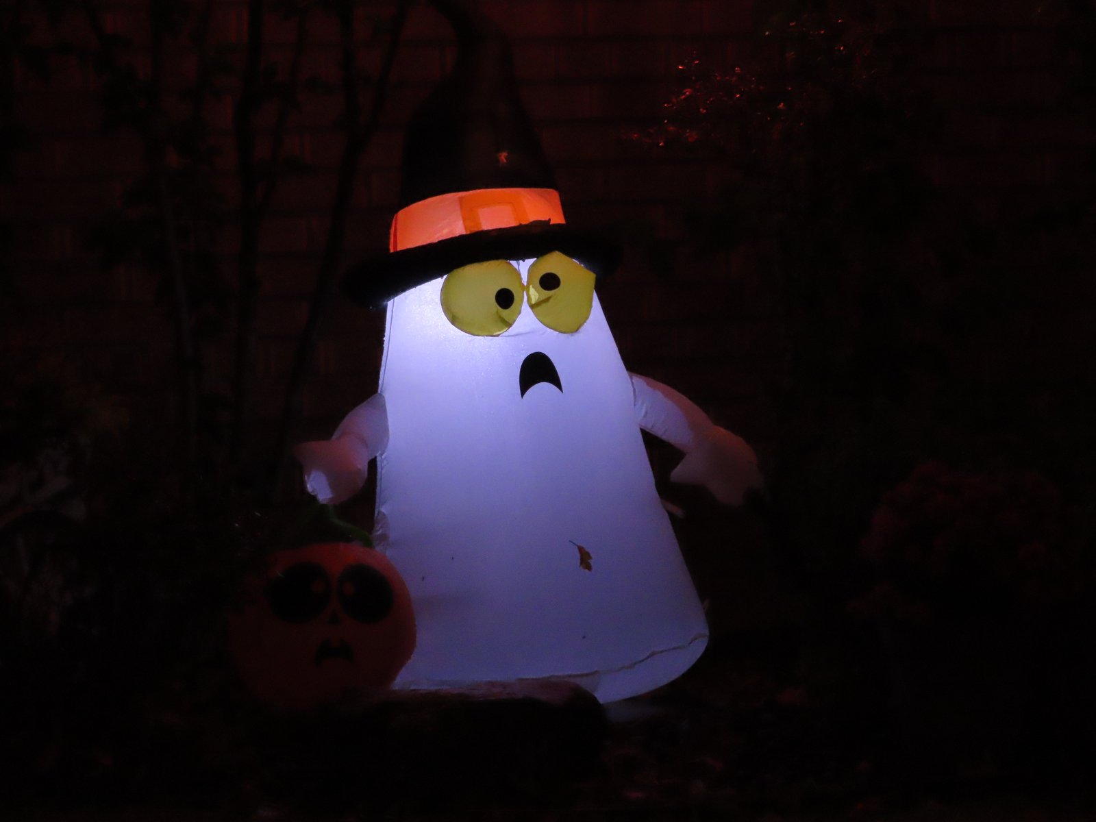 A frightened blowup ghost in a hat.